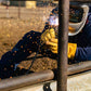 Welder in OR-WELD gloves working a corral rail with sparks