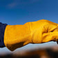 OUTRIDER OR-WELD pre-curved MIG glove gripping a rail